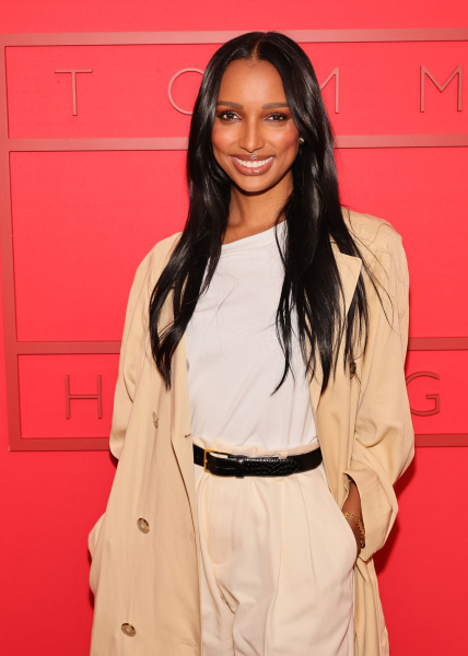 Jasmine Tookes at New York Fashion Week 2024 with long curtain bangs.